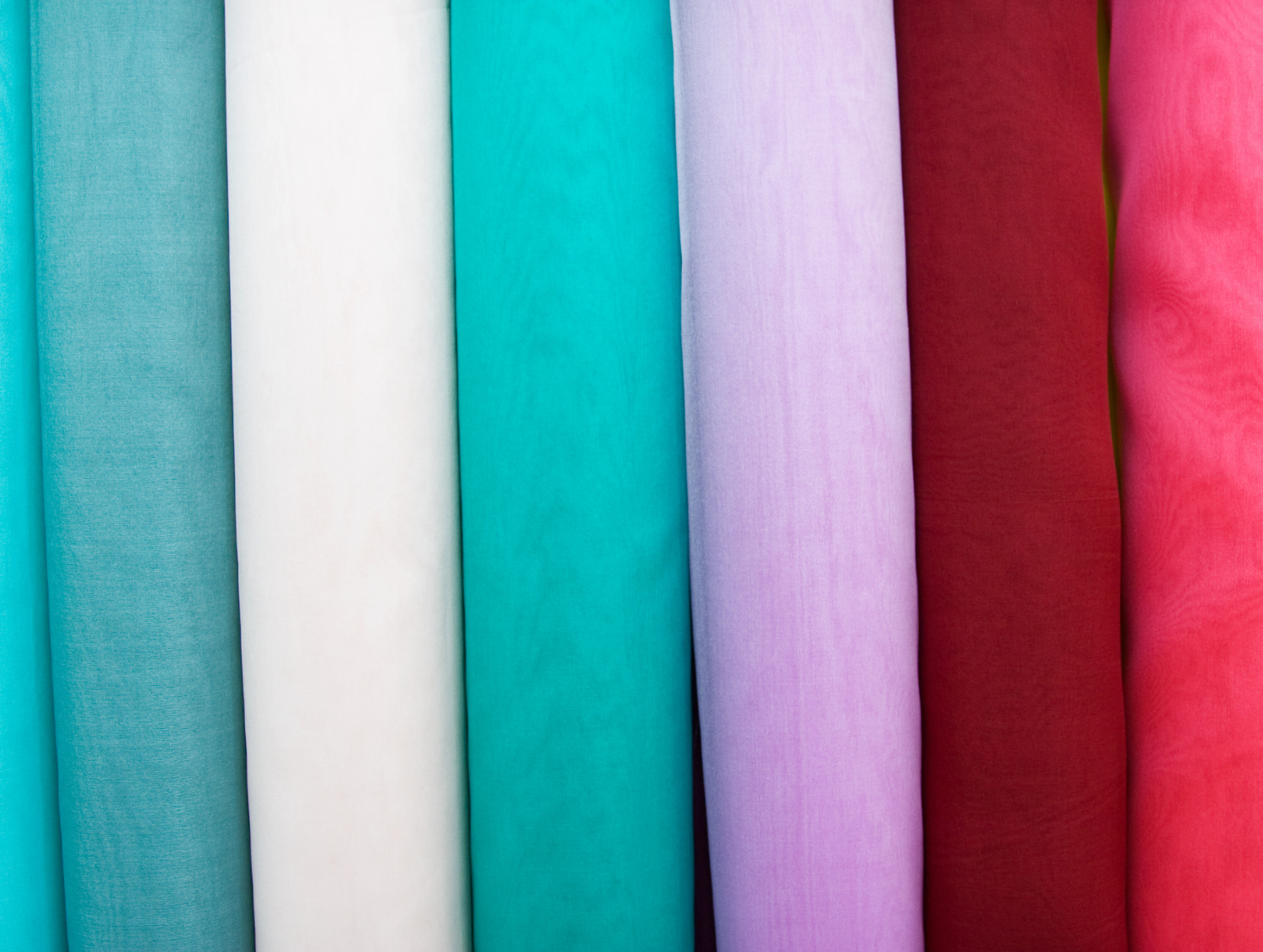 Rolls of coloured fabric